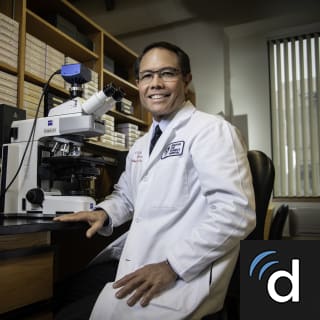 C Ozaki, MD